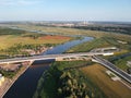 Drone photo, bridge over the river, in the sunset light. Panorama of the city of Kaliningrad, Russia.