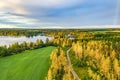 Drone photo, evening sun over summer pine tree forest,green wheat field, very clear skies and clean rainbow colors. Scandinavian Royalty Free Stock Photo