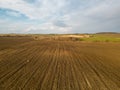 Drone photo of a plowed fields at sunset. Aerial view of a farmer\'s field. Abstract patterns and straight lines Royalty Free Stock Photo