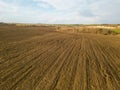 Drone photo of a plowed fields at sunset. Aerial view of a farmer\'s field. Abstract patterns and straight lines Royalty Free Stock Photo