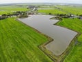 Drone photo of rice field and water storage pond Royalty Free Stock Photo