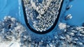 Drone photo of a sharp bend in the road with traffic in winter Royalty Free Stock Photo