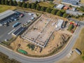 Drone photograph of a construction site with concrete supports for a factory building