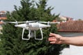 The drone and photographer man hands , The drone with the professional camera takes pictures. Royalty Free Stock Photo