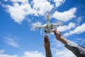 The drone and photographer man hands The drone with the professional camera takes pictures Royalty Free Stock Photo