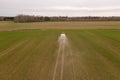 Drone photography of agricultural equipment working in field and spreading fertilizer Royalty Free Stock Photo