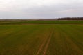 Drone photography of agricultural equipment working in field and spreading fertilizer Royalty Free Stock Photo