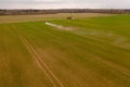 Drone photography of agricultural equipment working in field and spreading fertilizer Royalty Free Stock Photo