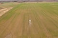 Drone photography of agricultural equipment working in field and spreading fertilizer Royalty Free Stock Photo