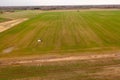 Drone photography of agricultural equipment working in field and spreading fertilizer Royalty Free Stock Photo