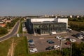 Drone photography of big logistical warehouse and its parking space in a city