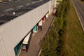 Drone photography of big logistical warehouse and its parking space in a city