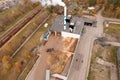 Drone photography of biomass power plant and biomass storage place during autumn day