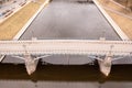 Drone photography of bridge over a a river in urban landscape during spring cloudy day Royalty Free Stock Photo