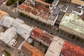 Drone photography of closed city and people running for a marathon during summer day