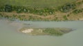 Aerial top view of summer green trees and roads, river, Russia.