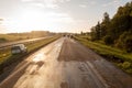 Drone photography of highway repair with heavy industrial machinery during autumn morning