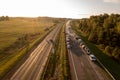 Drone photography of highway repair with heavy industrial machinery during autumn morning