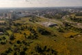 Drone photography of logistical warehouse, cityscape and highway road