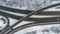 Drone photography of multiple lane highway with overpass in a city during winter Royalty Free Stock Photo