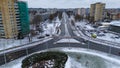 Drone photography of multiple lane road going straight though town during winter day Royalty Free Stock Photo