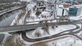 Drone photography of multiple lane road going in a town during winter day Royalty Free Stock Photo