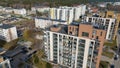 Drone photography of new multistory building with paint peeling of during summer day