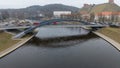 Drone photography of a river, bridge and city downtown during cloudy day Royalty Free Stock Photo