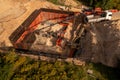 Drone photography of small construction site and workers building a building