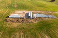 Drone photography of wind turbine parts in the middle of rural field