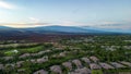 Drone photos over the Kohanaiki Private Club Community on the Big Island, Hawaii. With lush green landscape and luxury housing