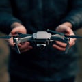 Drone Pilot Operating a Professional Drone in a Forest Royalty Free Stock Photo
