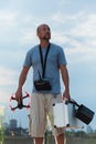 Drone pilot standing on the field