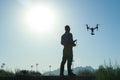 Drone pilot with sunrise on background