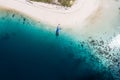 Drone point of view of a boat, white sand beach and turquoise sea Royalty Free Stock Photo