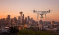 Drone quad copter with camera flying towards the city center