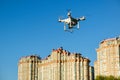 Drone quad copter with digital camera flying over the city Royalty Free Stock Photo