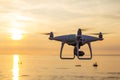 Professional drone quad copter with digital camera at sunset ready to fly for surveillance. close-up of Rotor UAV. four Royalty Free Stock Photo