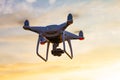 Professional drone quad copter with digital camera at sunset ready to fly for surveillance. close-up of Rotor UAV. four Royalty Free Stock Photo