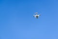 Drone quad copter flying in the blue sky