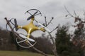 Drone quadcopter crashed on tree in city park Royalty Free Stock Photo