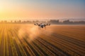 Drone quadcopter with digital camera flying in the air over agricultural field at sunset