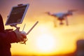 Drone quadcopter flying at sunset Royalty Free Stock Photo