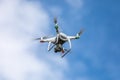 Drone quadrocopter with high resolution digital camera on the sky background. Royalty Free Stock Photo