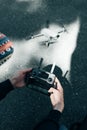 Drone remote control. Remote control in hand man. Man holds remote controller with his hands and controls the drone Royalty Free Stock Photo