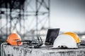 Drone, remote control, laptop and helmet at construction site Royalty Free Stock Photo