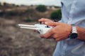 Drone remote control. Man holding copter controller with smartphone. Aerial video shooting Royalty Free Stock Photo