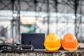 Drone, remote control, laptop and helmet at construction site Royalty Free Stock Photo