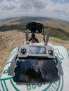 Drone remote controller with phone and camera in mountains