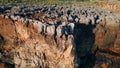 Drone rough stony rocks under summer sunlight. Dangerous cliff rugger stones.